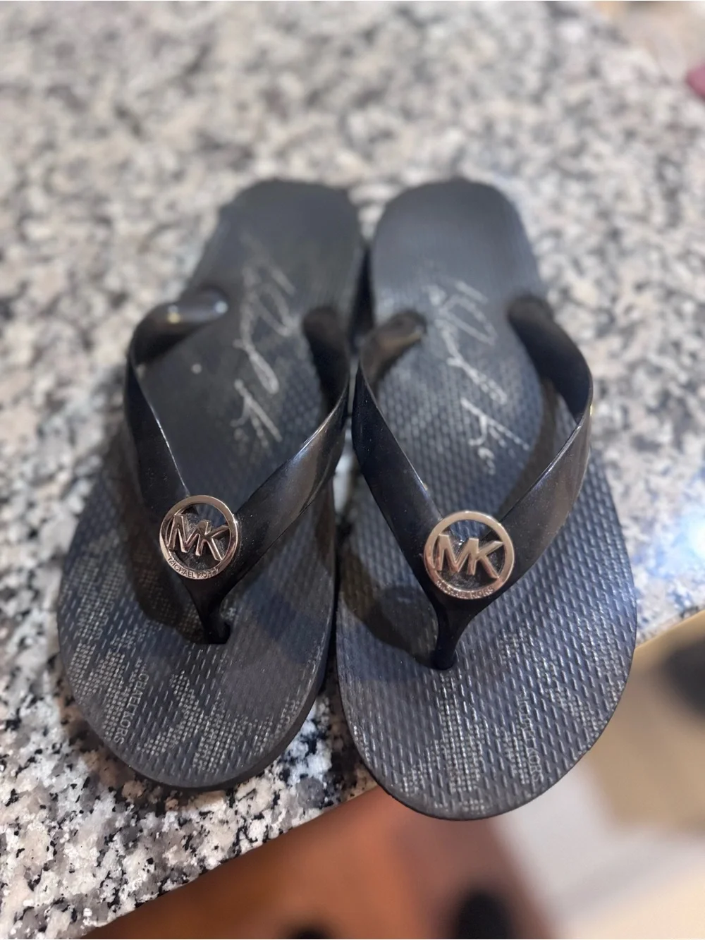 Michael Kors Black Jelly Flip Flops with Gold MK Medallion